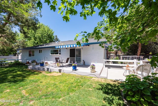 1745 Fir Tree Cir, Minden, NV 89423 - rear view of house featuring stucco siding and a patio