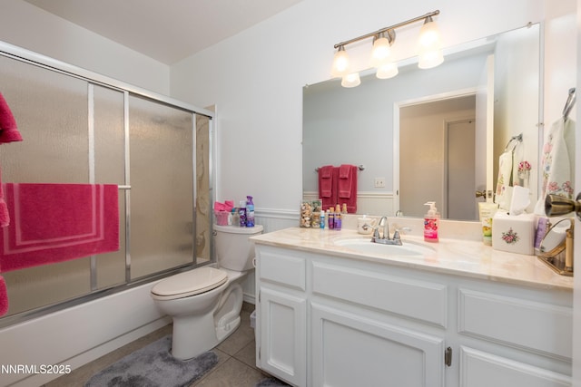 1745 Fir Tree Cir, Minden, NV 89423 - full bathroom featuring vanity, toilet, tile patterned flooring, and enclosed tub / shower combo