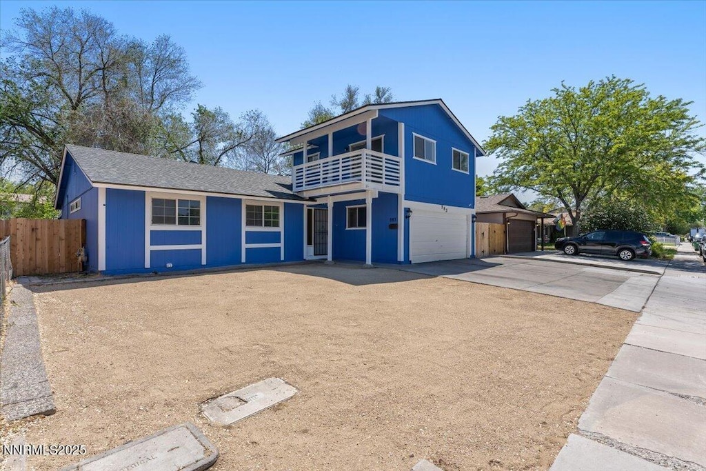 983 Glen Meadow Dr, Sparks, NV 89434 - view of front of home featuring a balcony, concrete driveway, and a garage