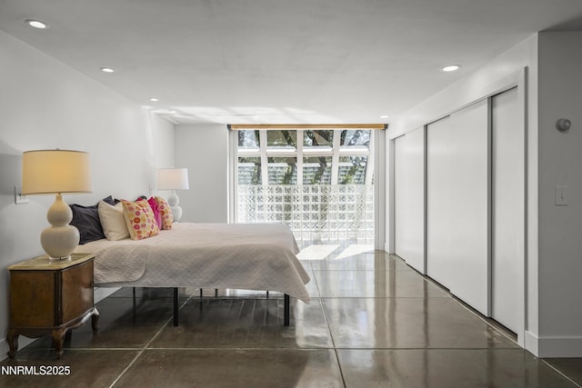 736 Kelly Dr, Incline Village, NV 89451 - bedroom with expansive windows, finished concrete floors, recessed lighting, and a closet