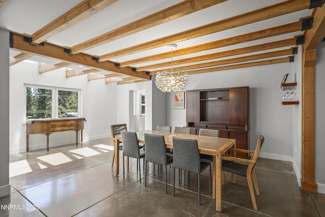 736 Kelly Dr, Incline Village, NV 89451 - dining area featuring beamed ceiling, baseboards, a chandelier, and concrete floors