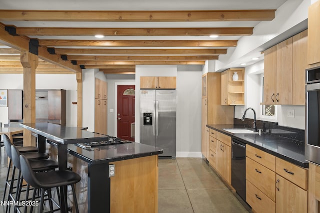 736 Kelly Dr, Incline Village, NV 89451 - kitchen with stainless steel appliances, a sink, a breakfast bar area, beam ceiling, and a kitchen island