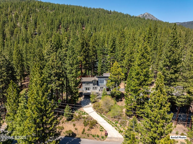 736 Kelly Dr, Incline Village, NV 89451 - aerial view of property and surrounding area with a heavily wooded area and mountains