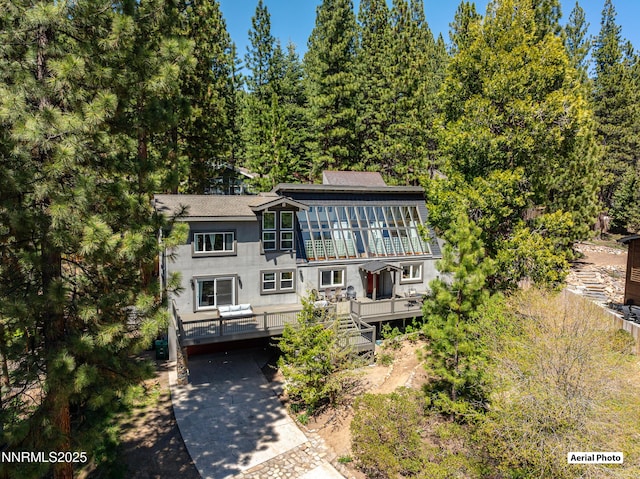 736 Kelly Dr, Incline Village, NV 89451 - view of front of property featuring a deck, stairs, and a shingled roof
