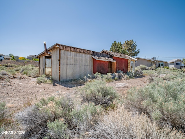 639 Mustang Ln, Gardnerville, NV 89410 - view of property exterior with an outbuilding