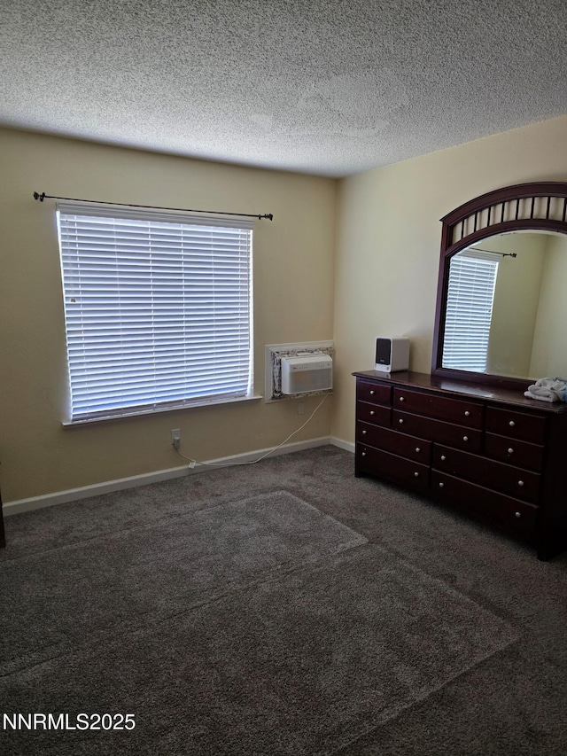 1035 Baywood Dr Unit D, Sparks, NV 89434 - bedroom with a wall mounted AC, carpet flooring, a textured ceiling, and baseboards