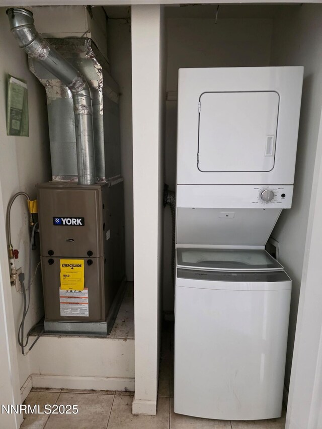 1035 Baywood Dr Unit D, Sparks, NV 89434 - washroom with stacked washing machine and dryer, tile patterned flooring, and heating unit