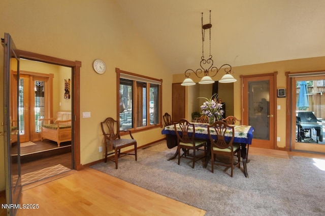1724 Mohican Dr, South Lake Tahoe, CA 96150 - dining area with wood finished floors and high vaulted ceiling