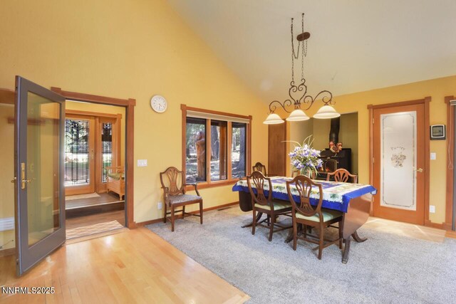 1724 Mohican Dr, South Lake Tahoe, CA 96150 - dining area with french doors, high vaulted ceiling, and wood finished floors