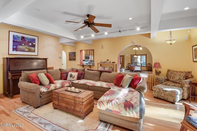 1724 Mohican Dr, South Lake Tahoe, CA 96150 - living room with arched walkways, light wood-style flooring, a ceiling fan, beamed ceiling, and recessed lighting