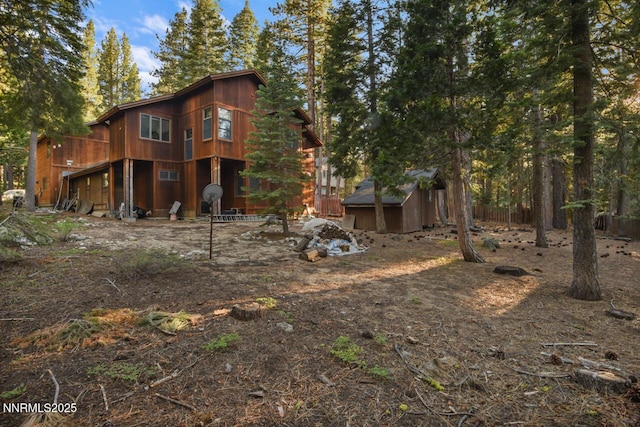 1724 Mohican Dr, South Lake Tahoe, CA 96150 - rear view of property with a storage shed