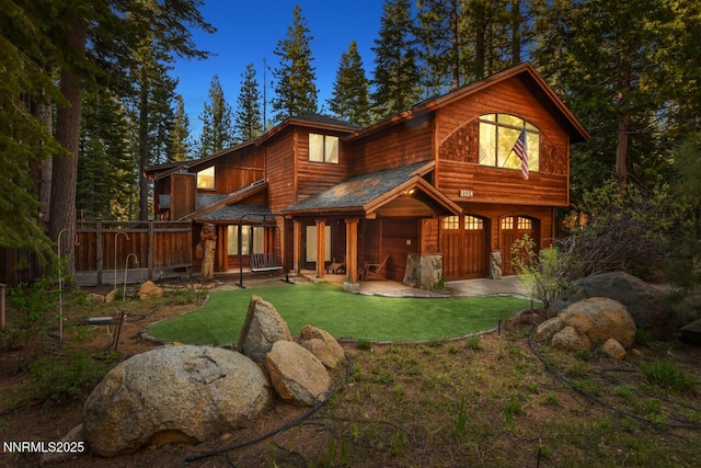 1724 Mohican Dr, South Lake Tahoe, CA 96150 - view of front of house featuring an attached garage and a front yard