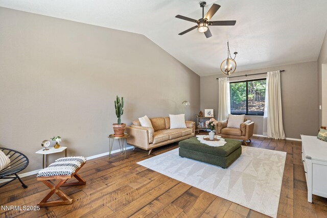 1626 Spring View Ct, Sparks, NV 89436 - living area featuring dark wood-type flooring, vaulted ceiling, a ceiling fan, baseboards, and a chandelier