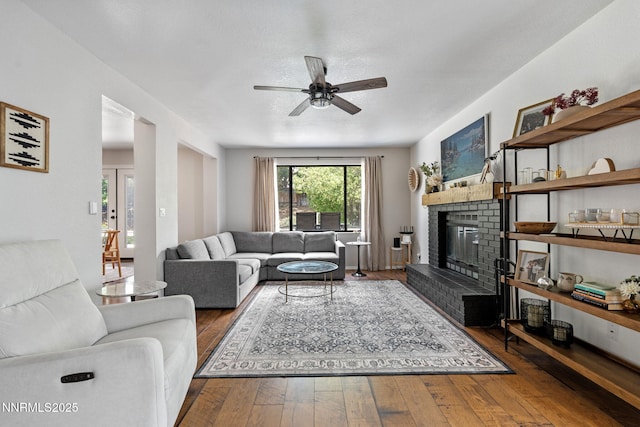 1626 Spring View Ct, Sparks, NV 89436 - living room featuring a ceiling fan, a brick fireplace, and hardwood / wood-style flooring