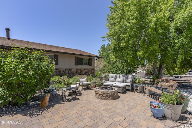 4840 Gentry Ln, Carson City, NV 89701 - view of patio / terrace with an outdoor living space with a fire pit