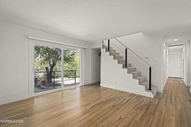 1420 Exeter Way, Reno, NV 89503 - unfurnished living room with wood finished floors, stairs, baseboards, and ornamental molding