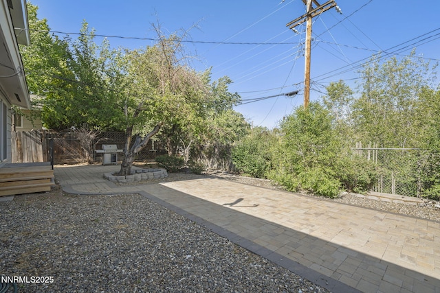 1420 Exeter Way, Reno, NV 89503 - fenced backyard with a patio area and a wooden deck