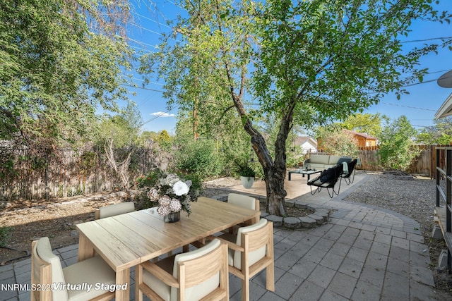 1420 Exeter Way, Reno, NV 89503 - fenced backyard with a patio, outdoor lounge area, and outdoor dining space