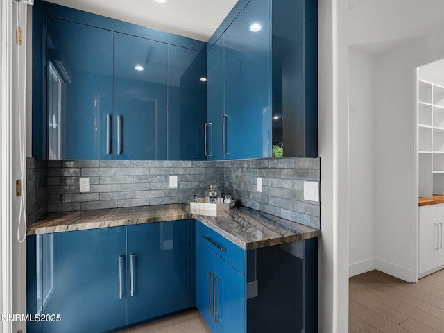 4485 Mountaingate Dr, Reno, NV 89519 - kitchen featuring blue cabinets, decorative backsplash, recessed lighting, dark countertops, and light wood-style floors