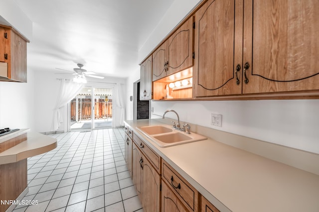 745 Rosewood Dr, Reno, NV 89509 - kitchen with a sink, ceiling fan, light countertops, light tile patterned floors, and brown cabinets