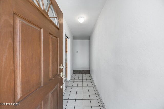 745 Rosewood Dr, Reno, NV 89509 - hallway featuring light tile patterned floors