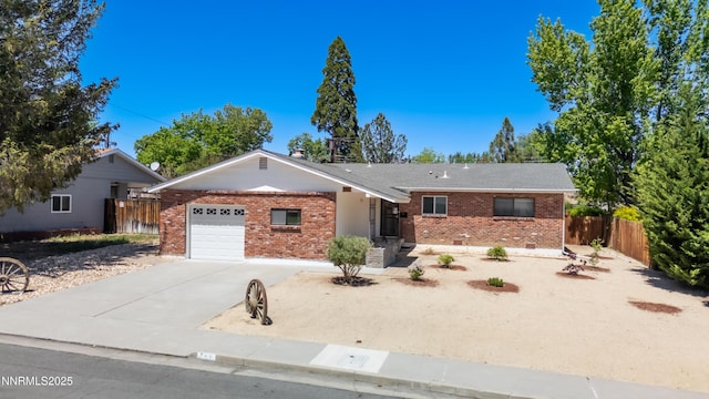 745 Rosewood Dr, Reno, NV 89509 - ranch-style house featuring brick siding, an attached garage, and concrete driveway