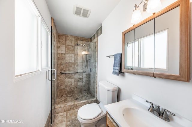 745 Rosewood Dr, Reno, NV 89509 - full bathroom featuring healthy amount of natural light, toilet, a stall shower, and vanity