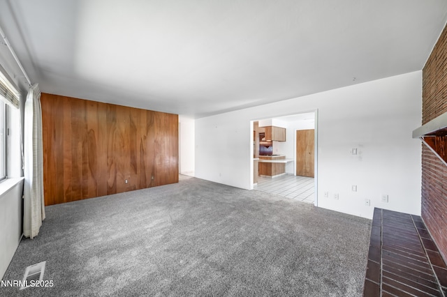 745 Rosewood Dr, Reno, NV 89509 - unfurnished living room with carpet flooring and a brick fireplace