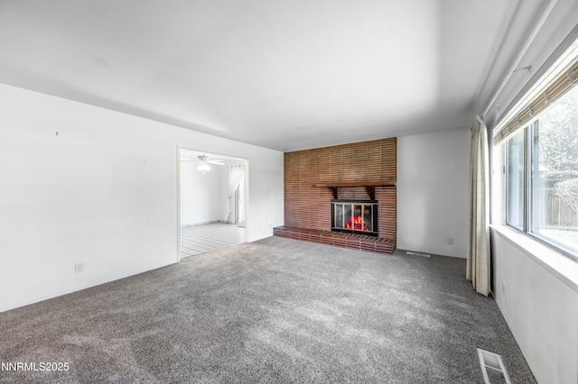 745 Rosewood Dr, Reno, NV 89509 - unfurnished living room featuring carpet, a fireplace, and a ceiling fan