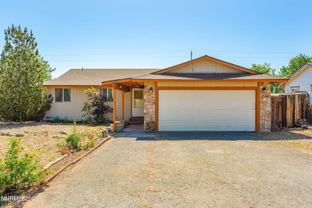 12 S Patterson Pl, Sparks, NV 89436 - single story home featuring stone siding, an attached garage, and driveway