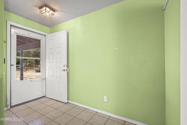12 S Patterson Pl, Sparks, NV 89436 - spare room with light tile patterned flooring, baseboards, and a textured ceiling