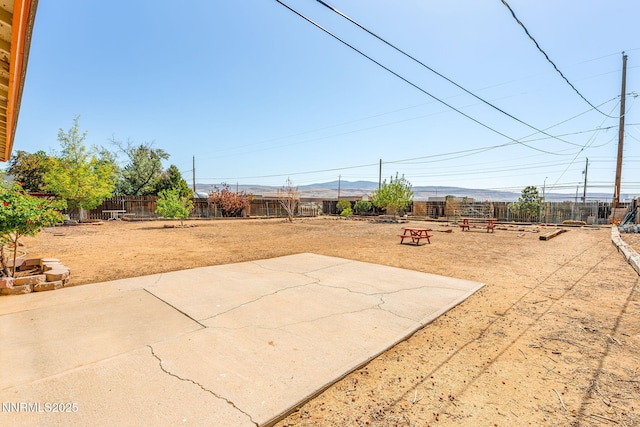 12 S Patterson Pl, Sparks, NV 89436 - fenced backyard featuring a mountain view and a patio area
