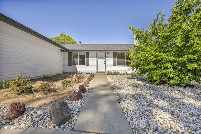 2480 Meadowbrook Ln, Carson City, NV 89701 - view of exterior entry with a shingled roof