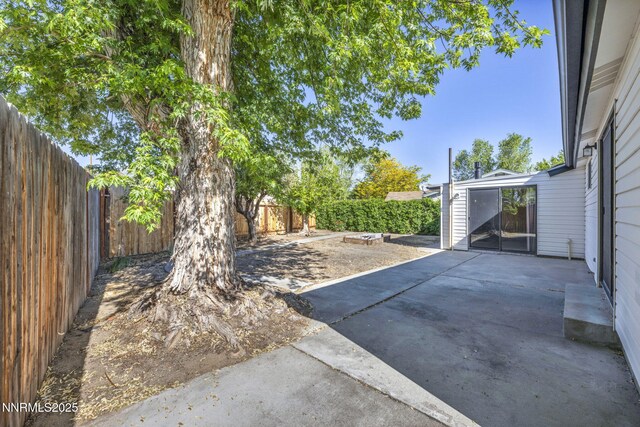 2480 Meadowbrook Ln, Carson City, NV 89701 - fenced backyard featuring a patio area