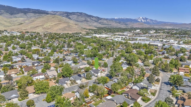 2480 Meadowbrook Ln, Carson City, NV 89701 - aerial view of property and surrounding area featuring a mountain backdrop and nearby suburban area