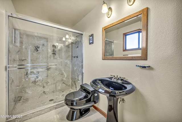 2480 Meadowbrook Ln, Carson City, NV 89701 - bathroom with toilet, a shower stall, and baseboards