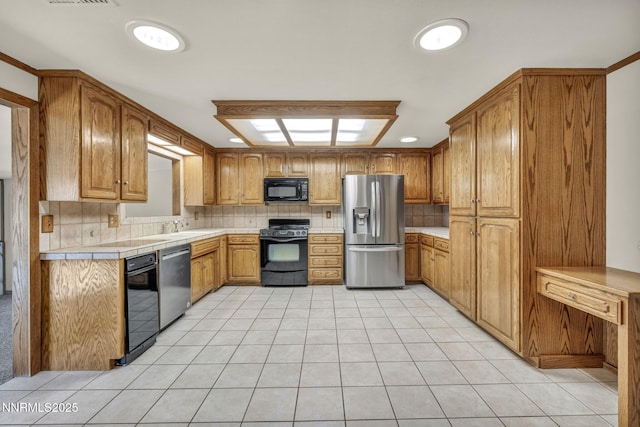 2480 Meadowbrook Ln, Carson City, NV 89701 - kitchen with black appliances, tasteful backsplash, light tile patterned flooring, brown cabinets, and tile countertops