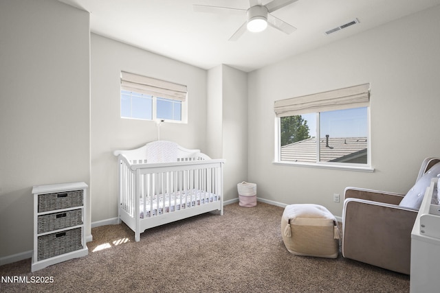 2266 Hayfield Ln, Fernley, NV 89408 - bedroom featuring carpet floors, a crib, baseboards, and ceiling fan