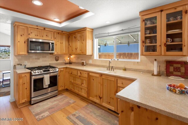 742 Long Valley Rd, Gardnerville, NV 89460 - kitchen with stainless steel appliances, light wood finished floors, backsplash, light countertops, and recessed lighting