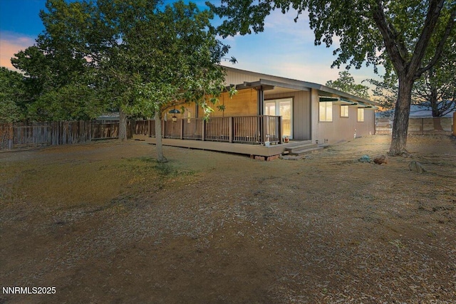 742 Long Valley Rd, Gardnerville, NV 89460 - back of property at dusk with a wooden deck