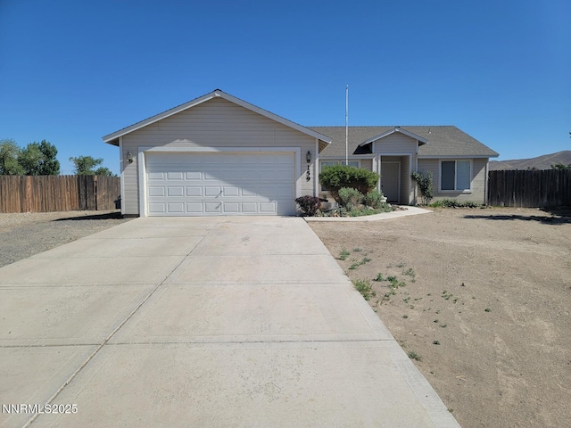 159 Shadow Mountain Dr, Fernley, NV 89408 - ranch-style home with driveway and an attached garage