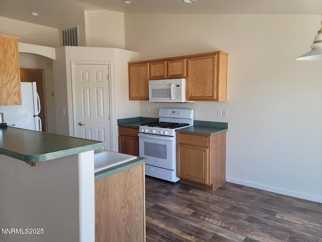 159 Shadow Mountain Dr, Fernley, NV 89408 - kitchen with white appliances, dark wood-type flooring, a peninsula, recessed lighting, and dark countertops