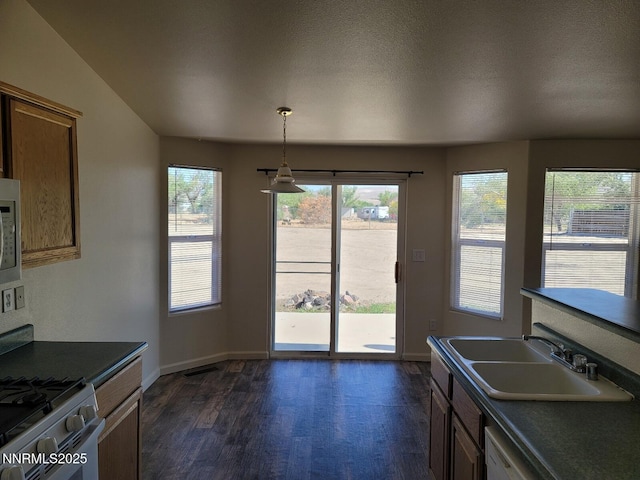 159 Shadow Mountain Dr, Fernley, NV 89408 - kitchen with a sink, dark countertops, dark wood finished floors, and baseboards