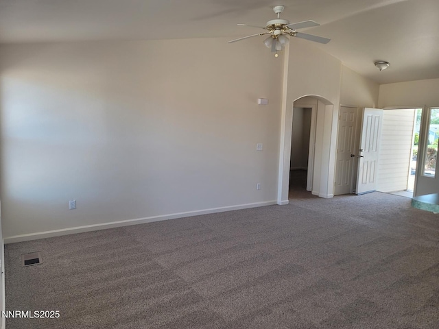 159 Shadow Mountain Dr, Fernley, NV 89408 - spare room featuring carpet flooring, arched walkways, ceiling fan, lofted ceiling, and baseboards