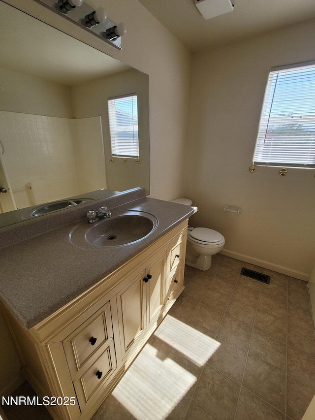 159 Shadow Mountain Dr, Fernley, NV 89408 - bathroom with vanity, toilet, tile patterned floors, and baseboards
