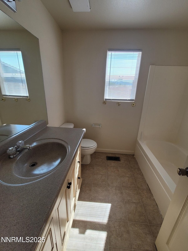 159 Shadow Mountain Dr, Fernley, NV 89408 - full bath featuring healthy amount of natural light, vanity, toilet, and tile patterned floors