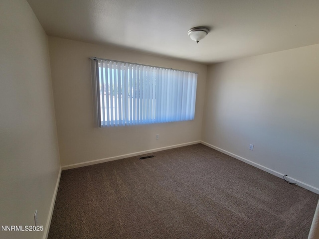 159 Shadow Mountain Dr, Fernley, NV 89408 - unfurnished room with dark carpet and baseboards