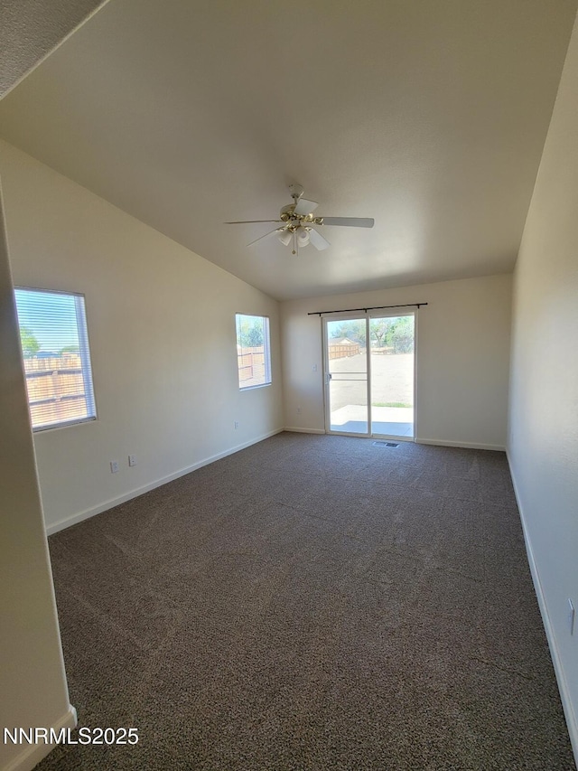 159 Shadow Mountain Dr, Fernley, NV 89408 - empty room featuring a ceiling fan, lofted ceiling, carpet flooring, and baseboards