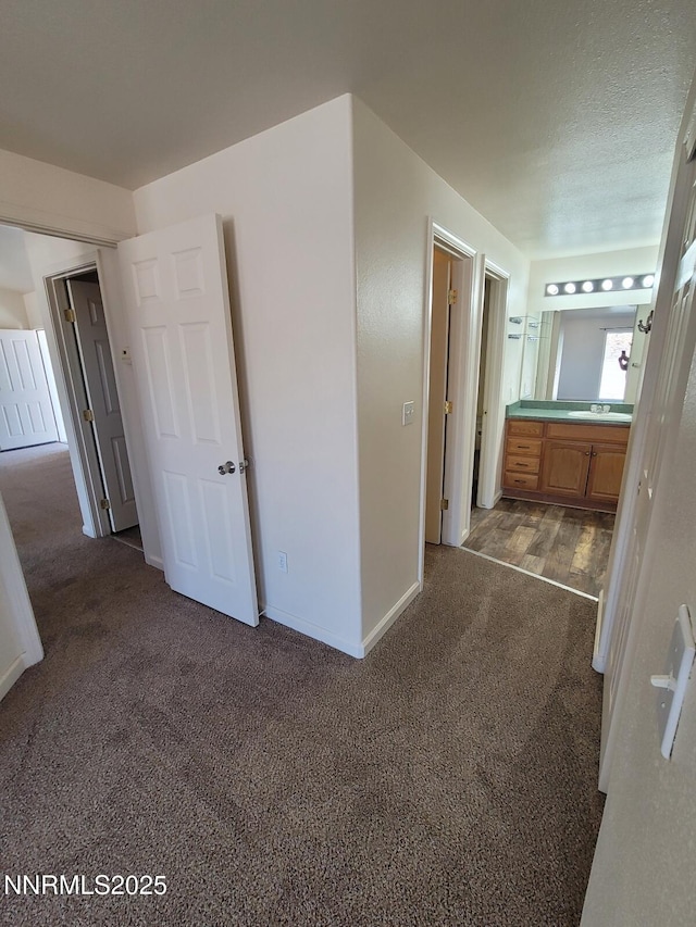 159 Shadow Mountain Dr, Fernley, NV 89408 - unfurnished bedroom featuring carpet flooring, baseboards, and ensuite bathroom