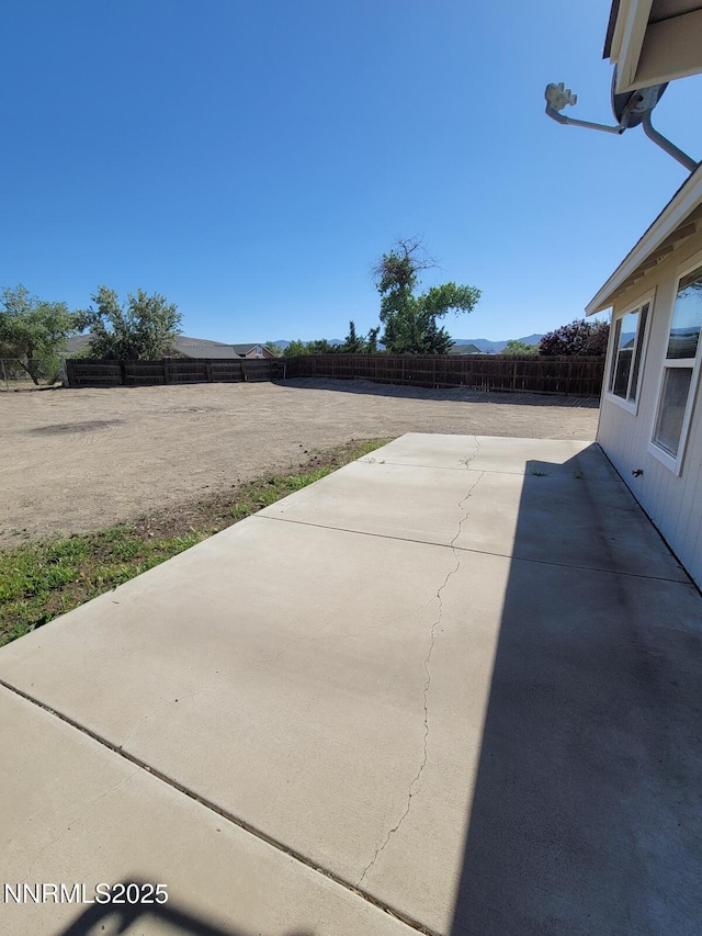 159 Shadow Mountain Dr, Fernley, NV 89408 - fenced backyard with a patio